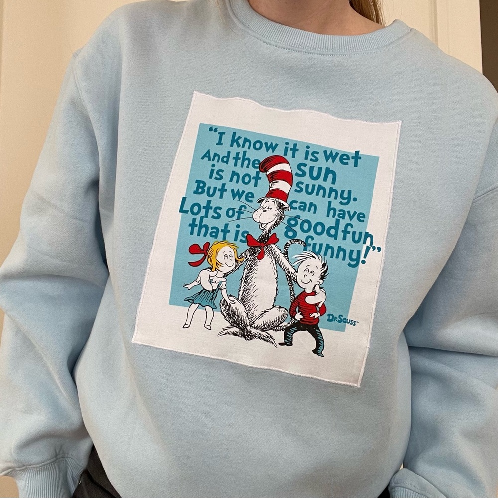 Reworked Dr. Seuss Cat & the Hat Light Blue Graphic Crewneck Sweater